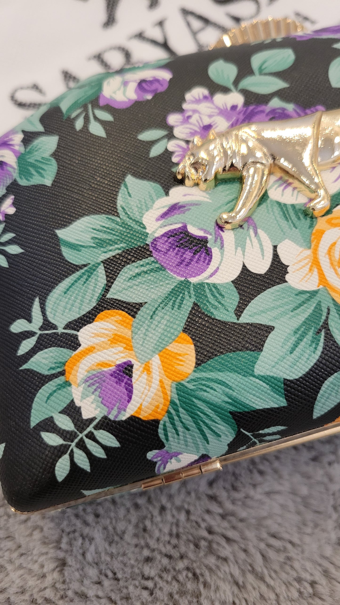 Black floral clutch