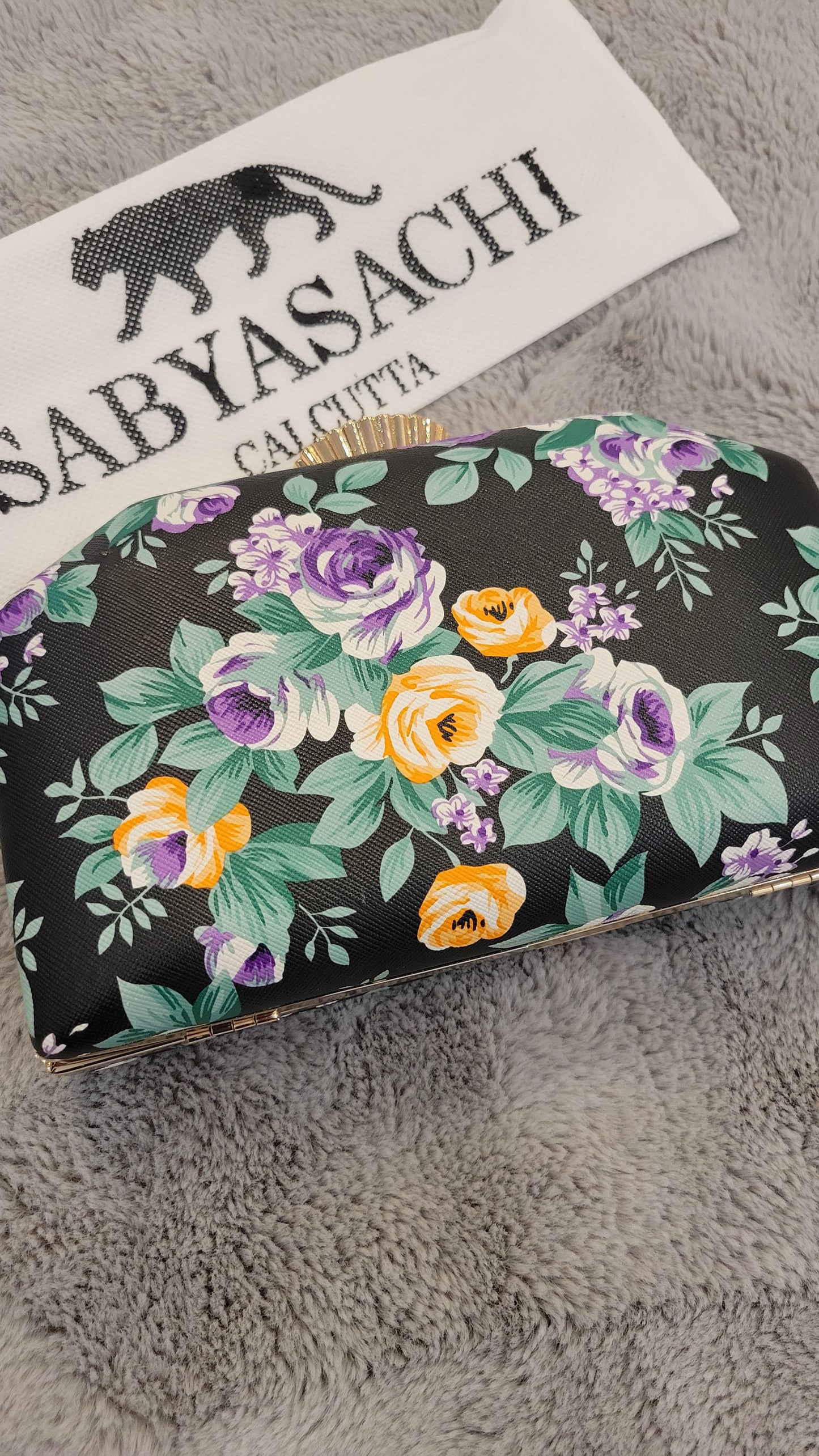 Black floral clutch
