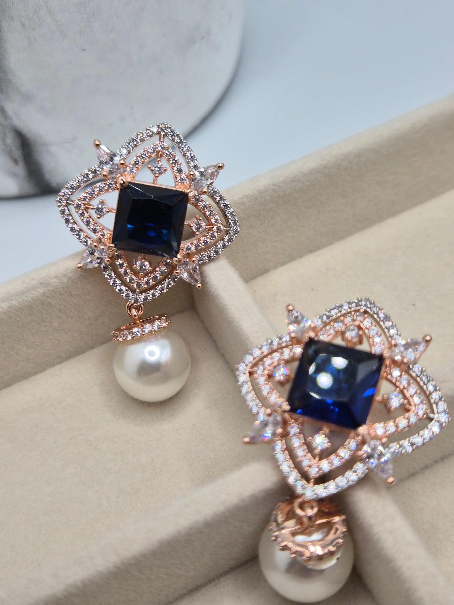 AD pearl earrings