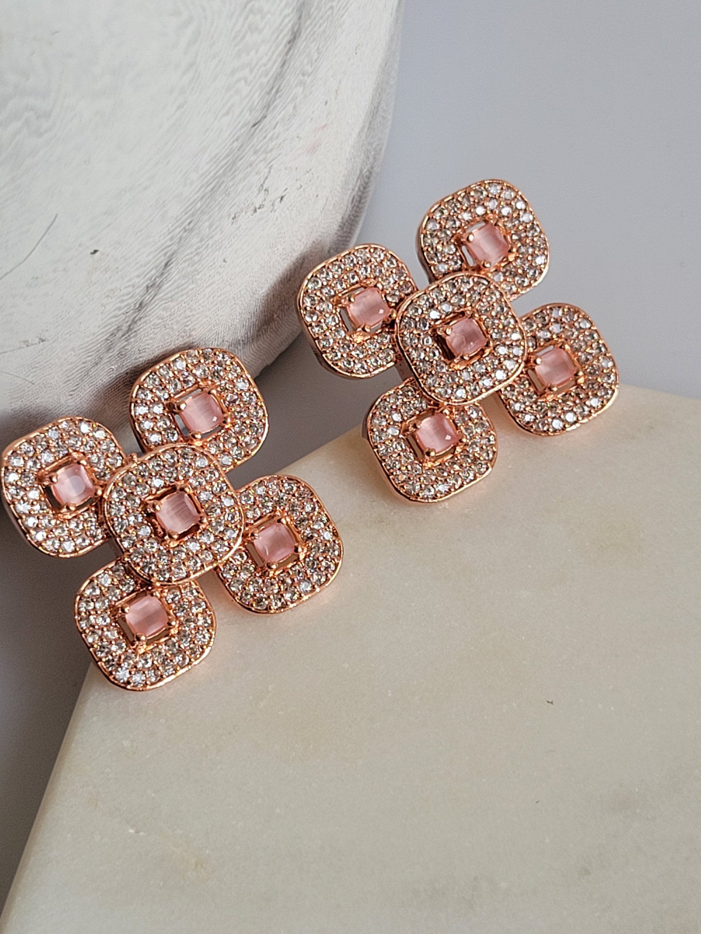 AD rose gold studs