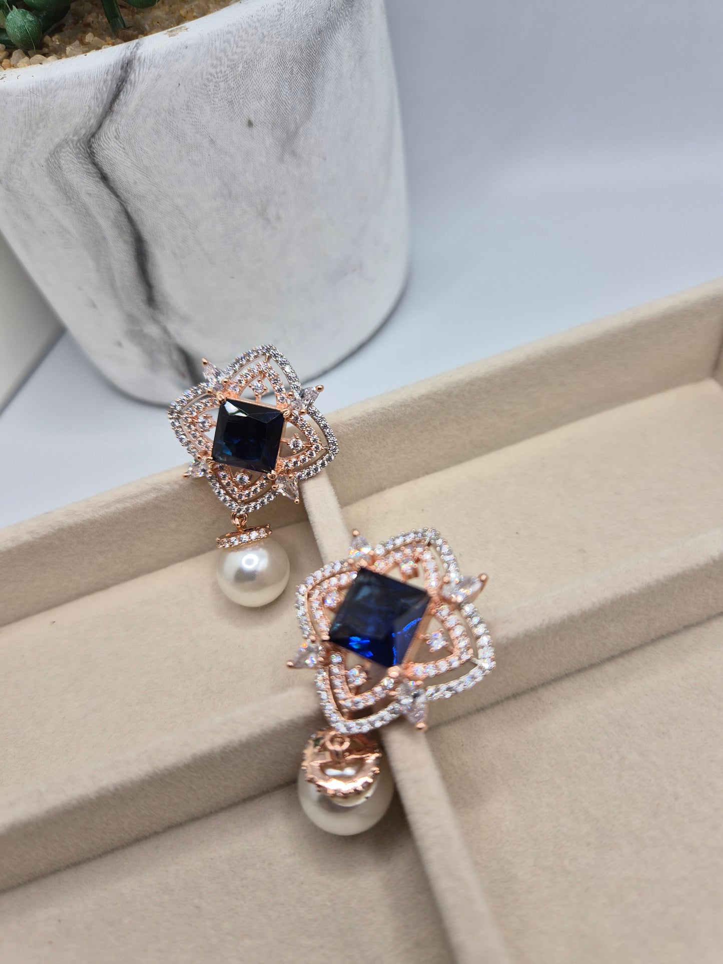 AD pearl earrings