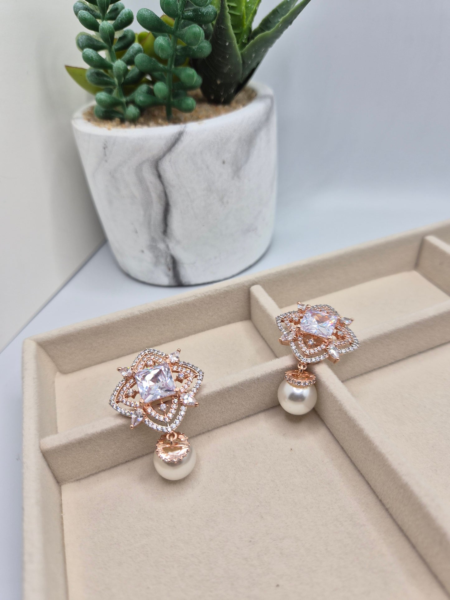 AD pearl earrings